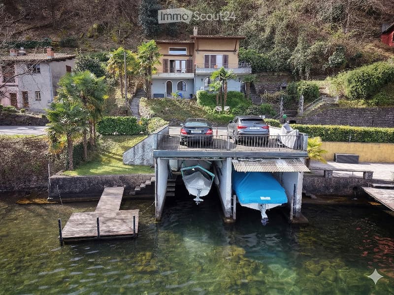 House with a garage for two cars and two boats, located on the lake
