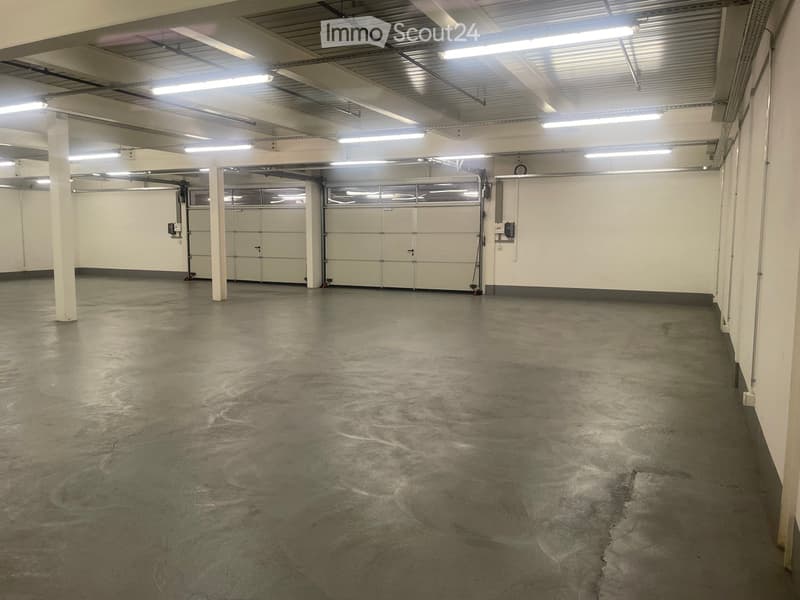 Unfurnished Room. Empty room with concrete floor, white walls, and metal ceiling with fluorescent lights.