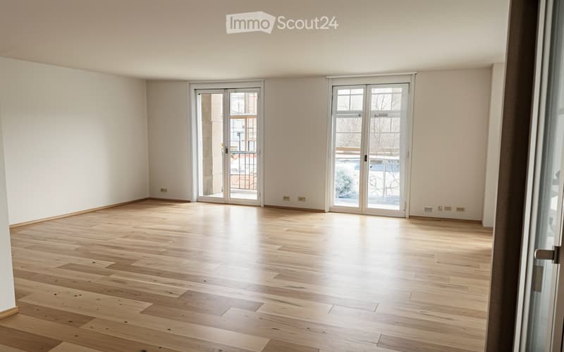 empty room, wooden floor, white walls, two glass doors leading to balcony, no furniture
