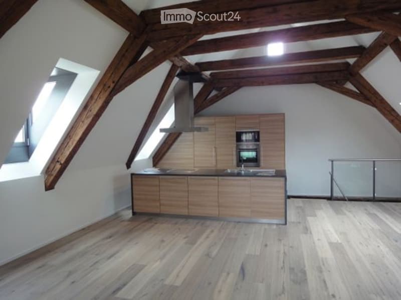 Modern kitchen with wooden beams, underfloor heating, wooden cabinetry, integrated appliances, tiled flooring
