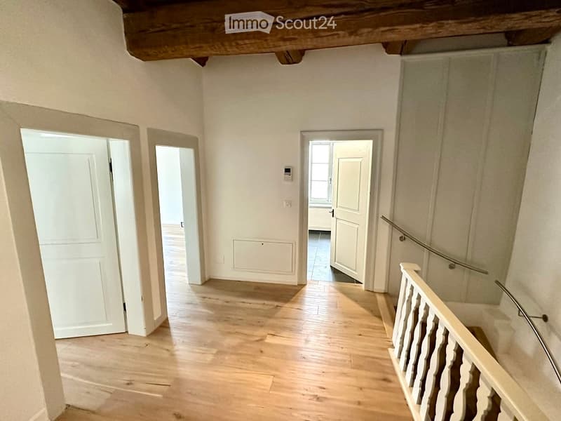 wooden floor, white walls, white doors, wooden staircase, wooden ceiling