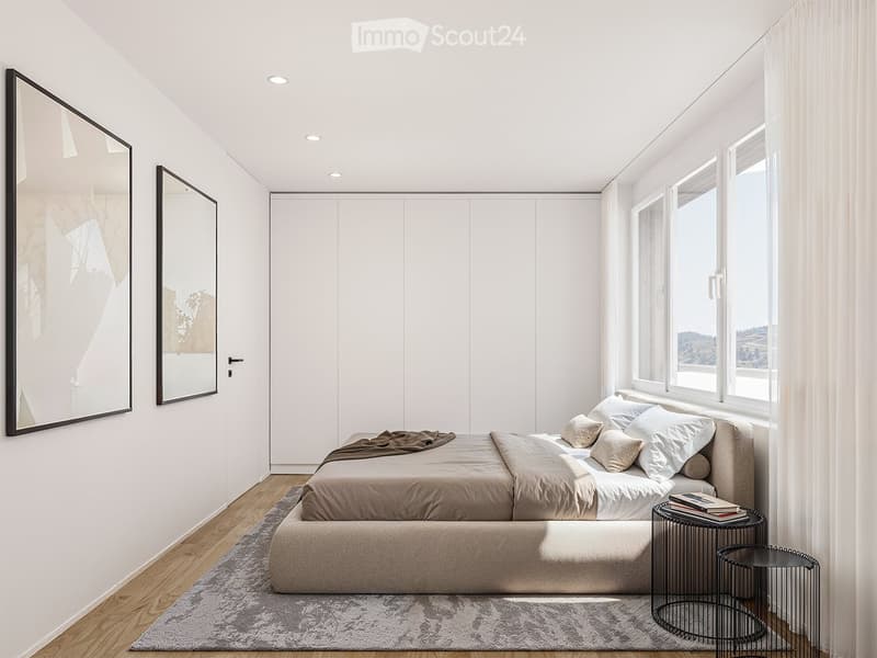 white walls, beige carpet, double bed with white sheets and brown blanket, two side tables with books, two large mirrors on the wall, window with white curtains, wooden floor