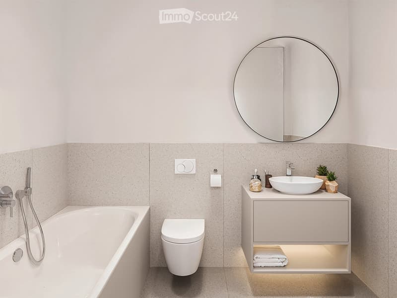 Bathtub, white toilet, large round mirror, sink with faucet, white tiled floor, wall-mounted cabinet with lit shelf