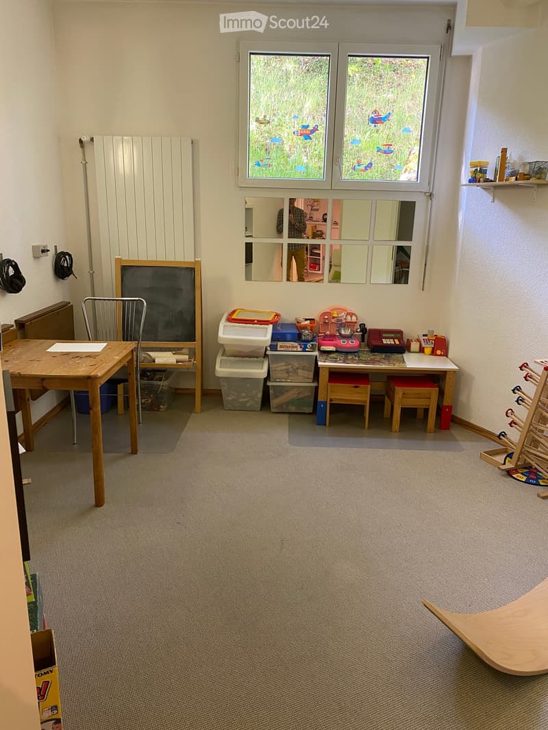 Other. {"visible_features": [], "type": "Furnished Room", "objects": ["desk", "chair", "blackboard", "storage boxes", "toys", "toy cash register", "toy phone", "toy cash register", "toy cash register", "toy cash register", "toy cash register", "toy cash r