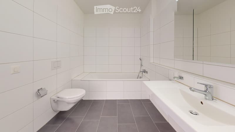 white tiles, bathtub, toilet, sink, mirror, white fixtures