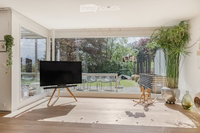 {"visible_features": ["View"], "type": "Furnished Room", "objects": ["television", "tv stand", "plant", "rocking horse", "plant pot", "plant", "plant pot", "plant", "plant pot", "plant", "plant pot", "plant", "plant pot", "plant", "plant pot", "plant", "p