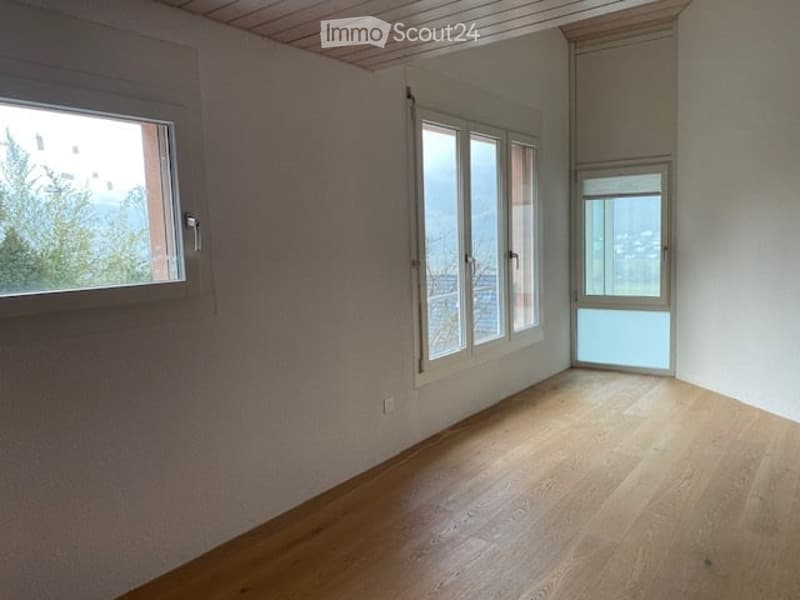 wooden floor, white walls, windows, large view