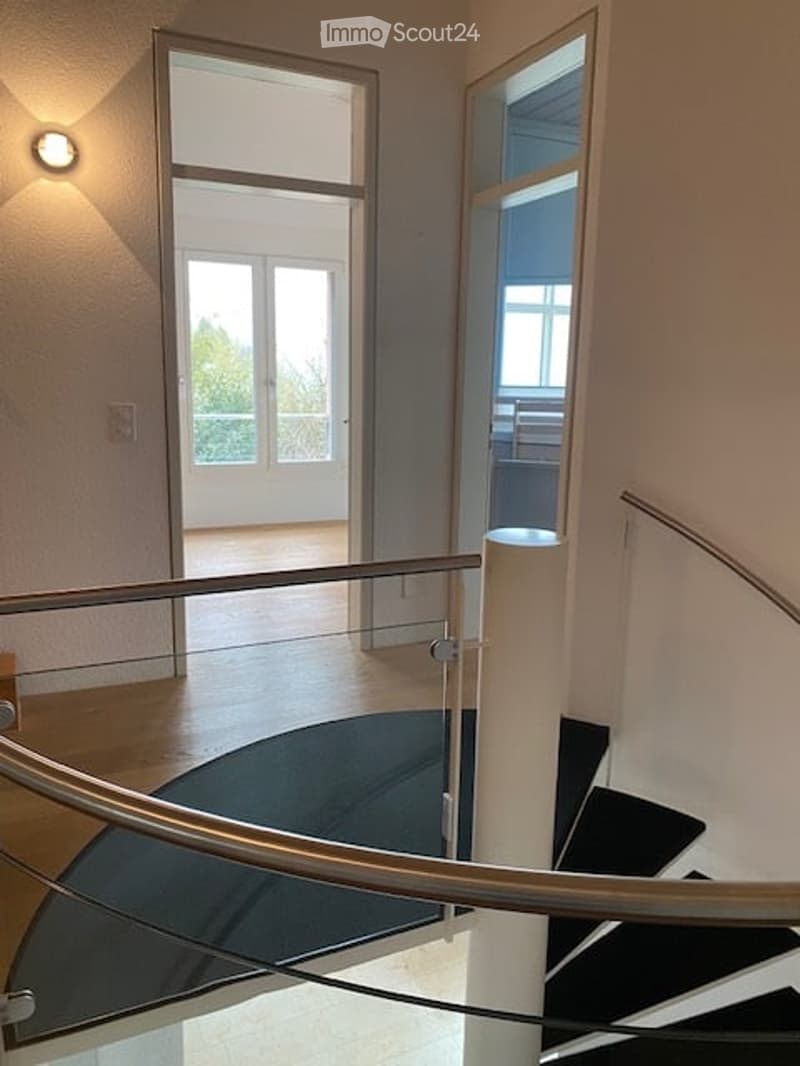 Glass railings, black stair, white floor, glass door, windows