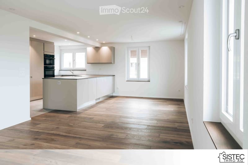 open plan kitchen with island, white cupboards, wood flooring, modern kitchen appliances, double windows