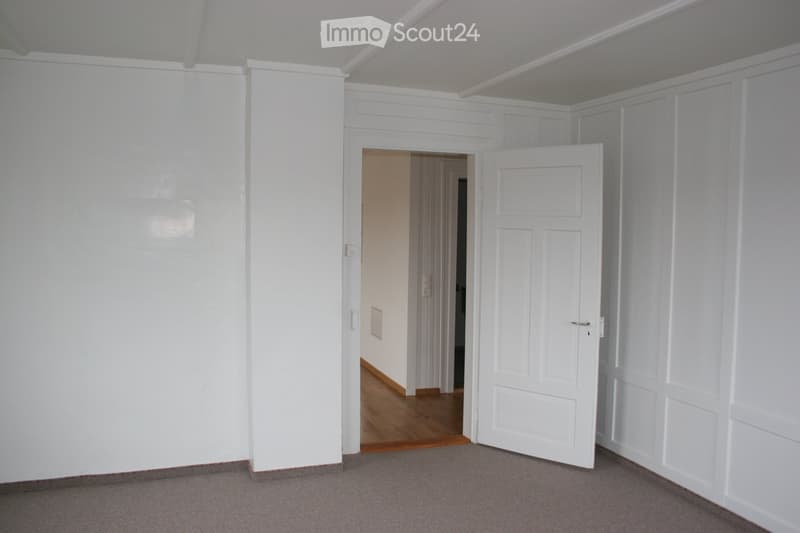 empty room, white walls, wooden floor, open door