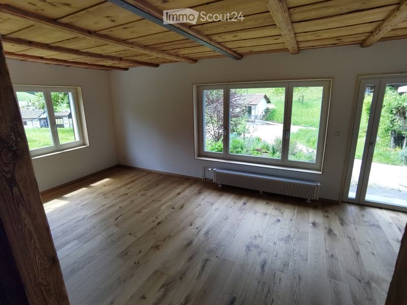 Unfurnished Room. Empty room with wooden ceiling, wooden floor, and large windows. No furniture or equipment.