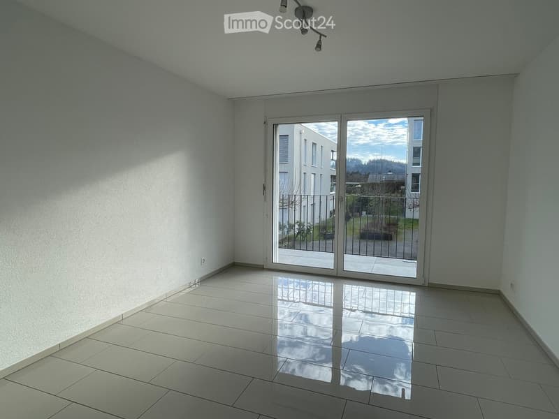 empty room, tile flooring, sliding glass doors to terrace, white walls