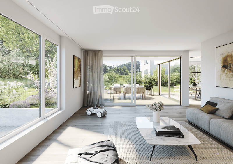 Living Room. Modern living room with large windows and sliding glass doors leading to a patio, featuring a grey sofa, coffee table, ottoman, and a small toy car.