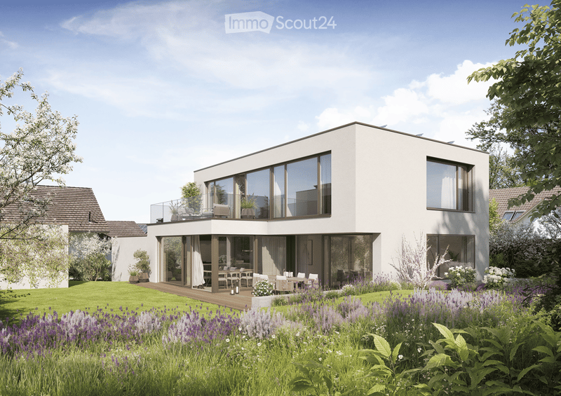 House. Modern two-story house with white exterior, large windows, and a raised ground floor. Features a spacious garden with lavender and other plants, a wooden deck, and outdoor seating area.
