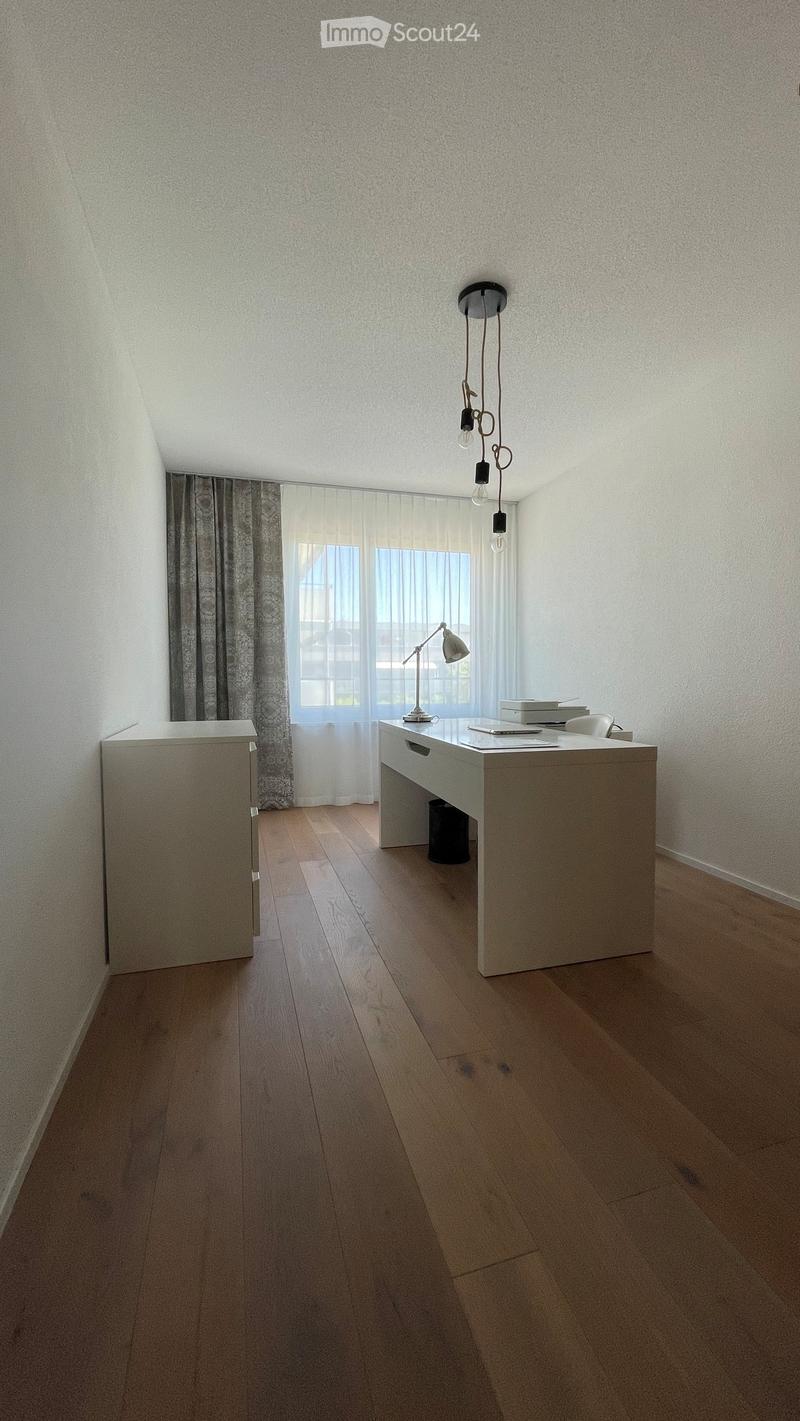 empty room, white desk, white cabinet, white curtains, wooden floor, white walls, ceiling lamp