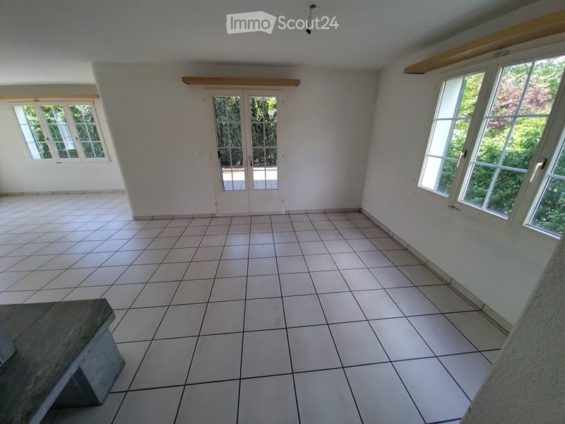 Unfurnished Room. Empty room with tiled floor, white walls, large windows, and a glass door leading outside.