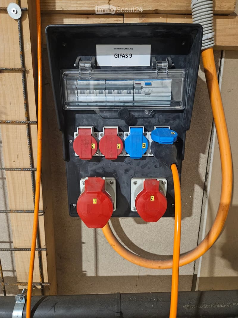 Other. Electrical panel with circuit breakers, switches, and cables mounted on a wooden wall.