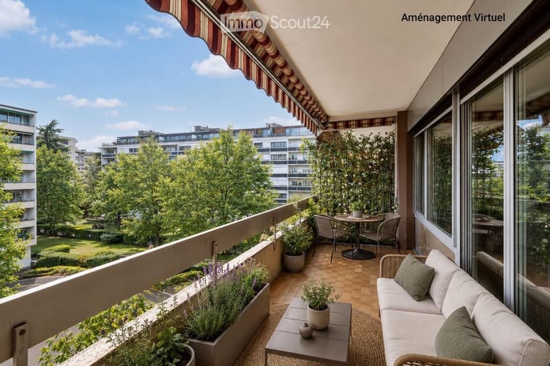 Balcony / Terrace. Balcony with a view of a park, featuring a sofa, small table, chairs, and potted plants.