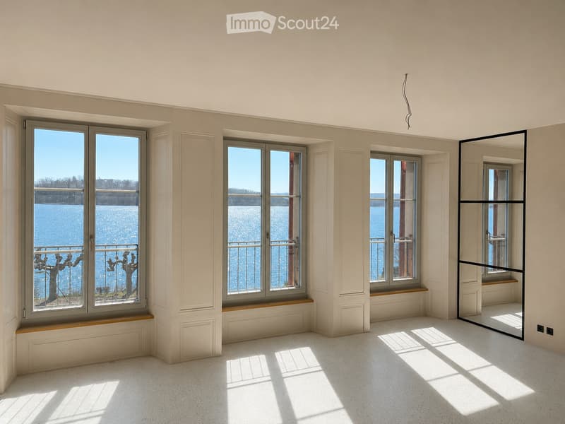 Unfurnished Room. Bright, empty room with large windows offering a scenic view of a body of water. The room features light-colored walls, a polished concrete floor, and built-in window seats.