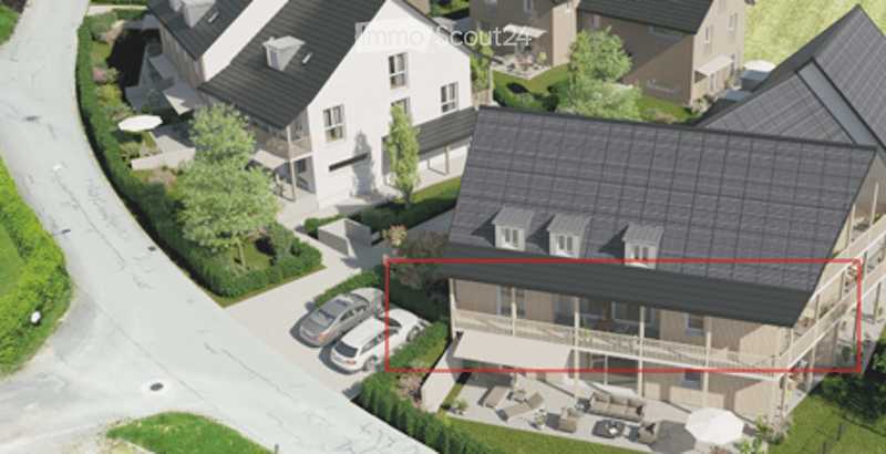 Aerial view of a residential area with multiple houses, parking spaces, and outdoor seating areas.