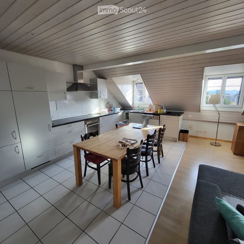 open kitchen with dining area, couch, wooden floors, large windows