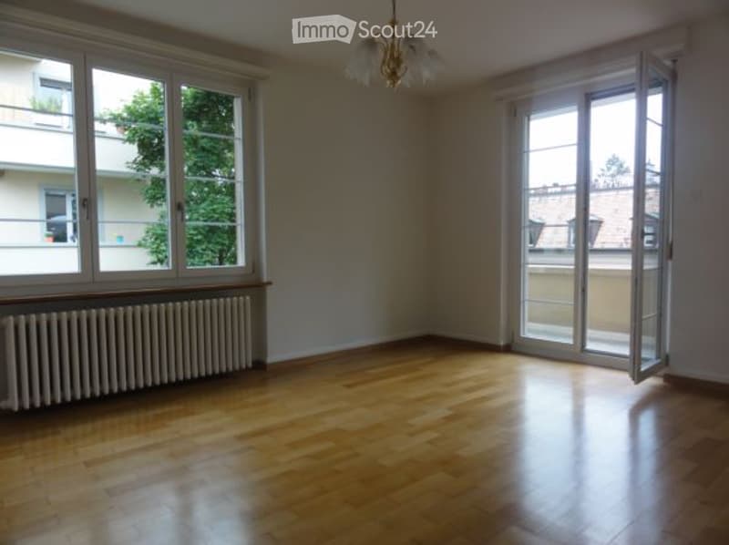 hardwood floor, two windows, sliding doors, heater
