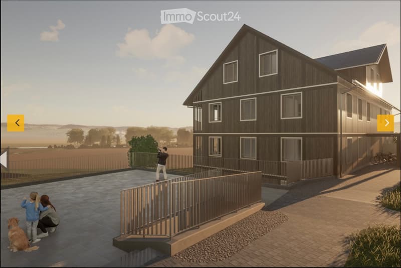 A modern two-story house with dark wooden siding and white-framed windows, featuring a raised ground floor with a balcony and a spacious outdoor patio area.
