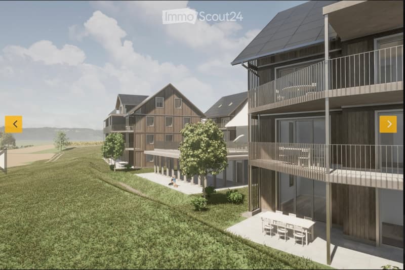 Modern residential complex with wooden facades, solar panels, balconies, and outdoor seating areas.