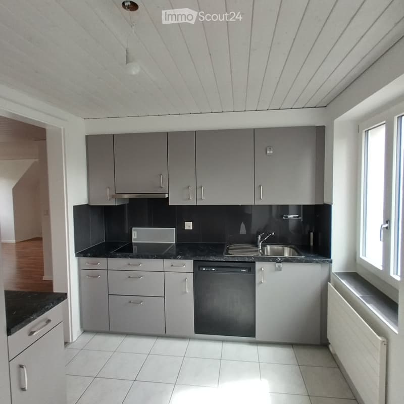 modern gray cabinets, black marble countertops, stainless steel sink and faucet, electric stovetop, dishwasher, white ceiling, white tiled floor