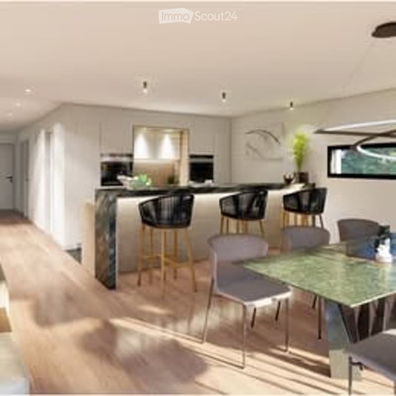 Modern, open-plan kitchen and dining area with a central island, bar stools, a dining table with chairs, and a potted plant on the counter.