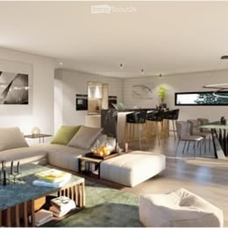 Modern, open-concept living and dining area with a white sofa, coffee table, ottoman, dining table with chairs, and a kitchen island with bar stools. The space features large windows, a green plant, and contemporary decor.