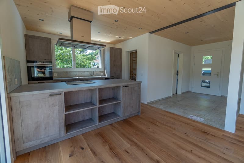 kitchen with island, oven, windows, wooden floors, wooden ceiling