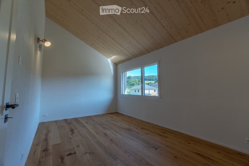 empty room, wooden floor, white walls, single window, wooden ceiling, view of houses and trees