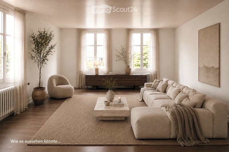 Modern living room with large windows, cream-colored sofa, armchair, coffee table, floor lamp, and decorative vases.