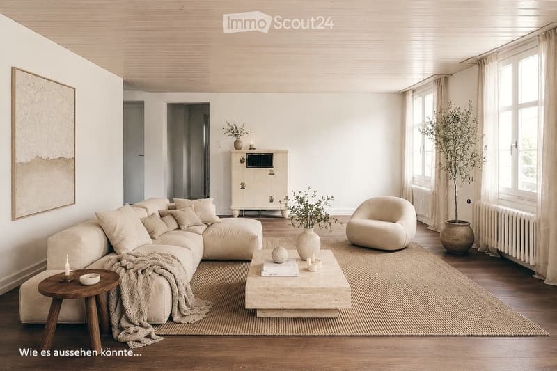 Modern living room with a large sectional sofa, coffee table, side table, armchair, and decorative vases. The space features light-colored walls, wooden flooring, and large windows with sheer curtains.