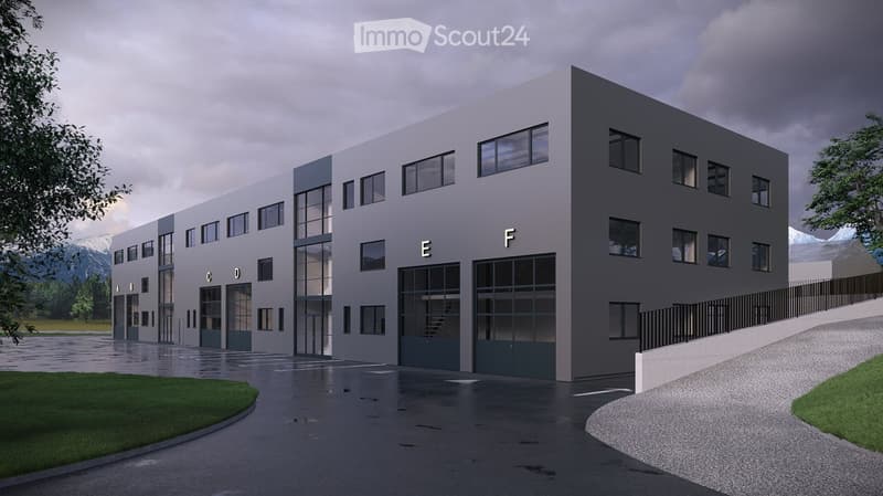 modern office building, grey exterior, large windows, multiple garages, paved parking area