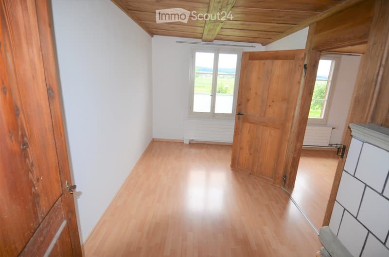 empty room, wooden floor, wooden ceiling, wooden doors, windows, radiators