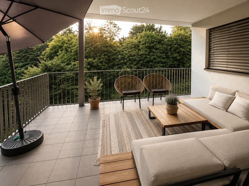Balcony with a sofa, wooden table, two chairs, potted plants, and a sun umbrella, overlooking a lush green view.
