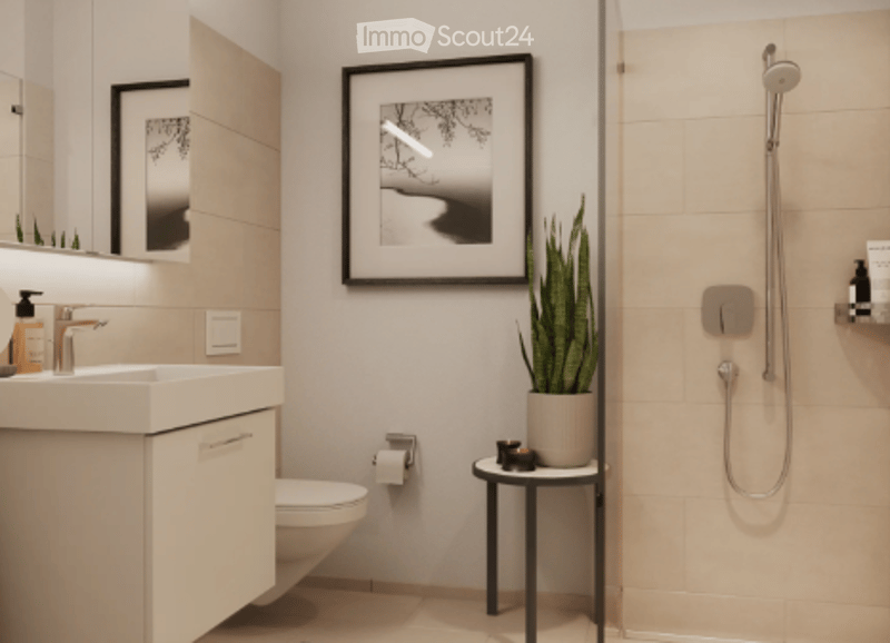 Modern bathroom with shower, toilet, sink, and potted plant.