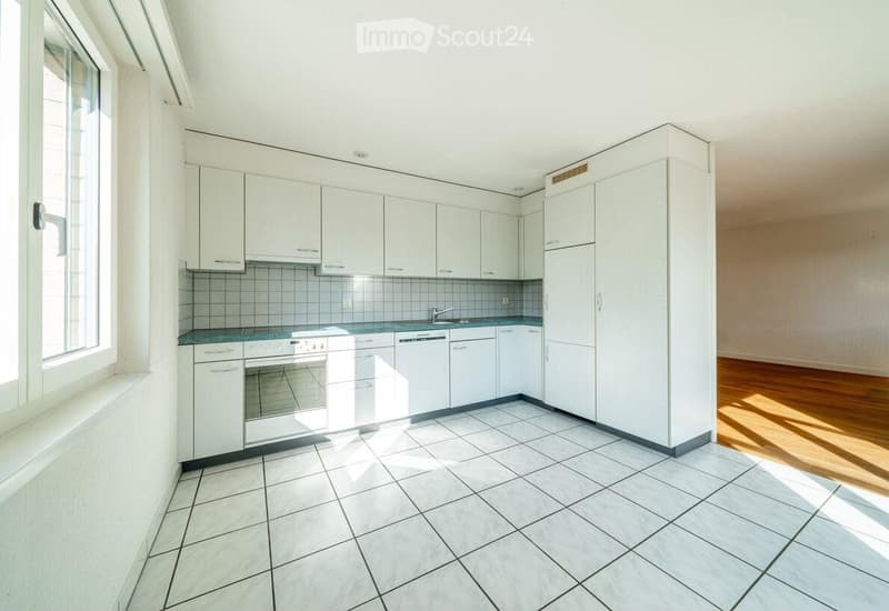Kitchen. Modern kitchen with white cabinets, a refrigerator, oven, dishwasher, and tiled floor.