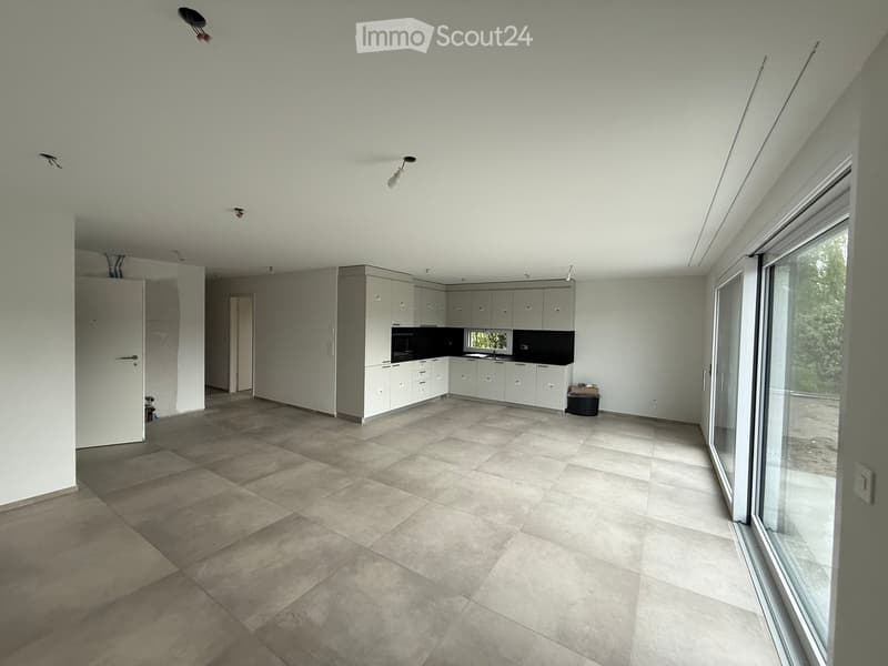 Kitchen. Modern kitchen with white cabinets, a sink, and large windows, featuring a tiled floor and neutral color palette.