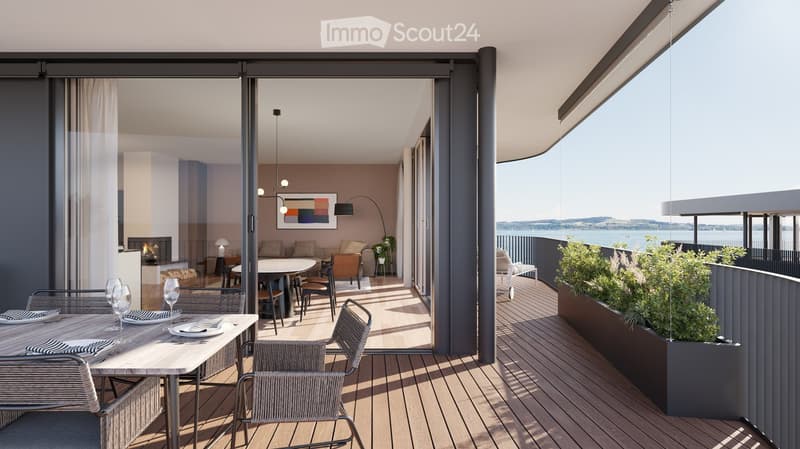 Dining area with table and chairs, glass doors, balcony, view of the sea