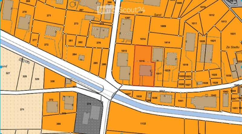 Floor plan of a residential area showing multiple plots and buildings with numbered sections.