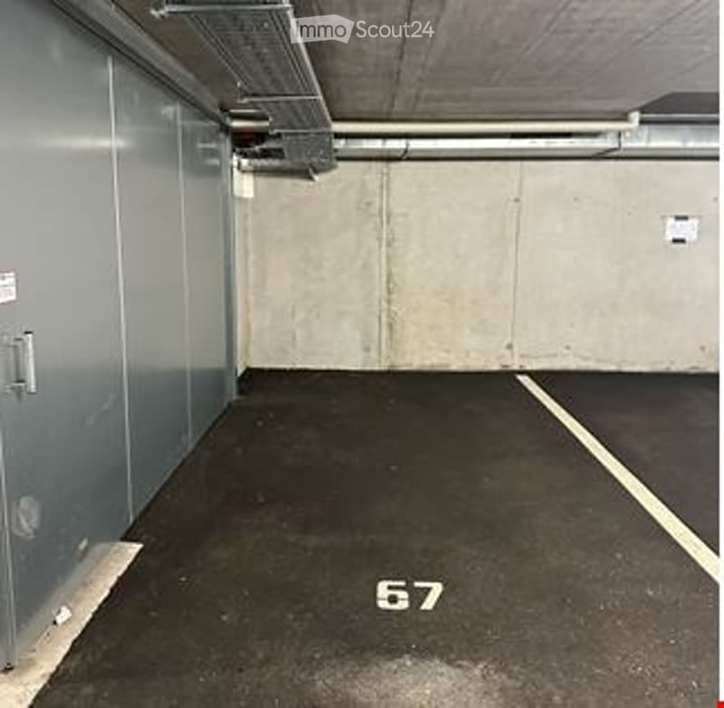 {"type": "Parking place", "objects": [], "description": "Underground parking space with concrete walls, metal doors, and a marked parking spot labeled \"67\".", "localized_descriptions": {"EN": "Underground parking space with concrete walls, metal doors,