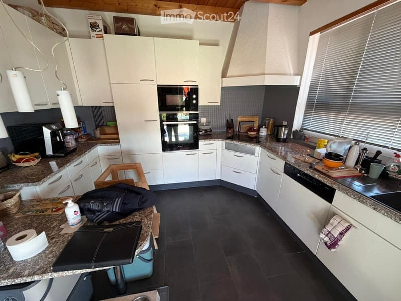 {"type": "Kitchen", "objects": ["cabinets", "oven", "microwave", "dishwasher", "coffee maker", "toaster", "fridge", "sink", "stool", "laptop", "backpack", "cutting board", "bowl", "cup", "bottle", "faucet", "blinds", "oven mitts", "oven gloves", "oven cle