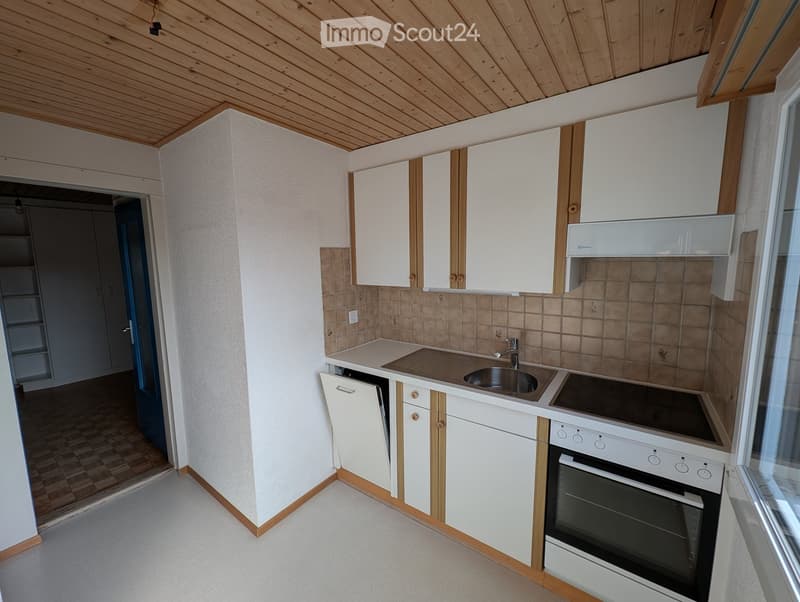 kitchen with white cabinets, tiled backsplash, sink, stove, oven, dishwasher, washing machine