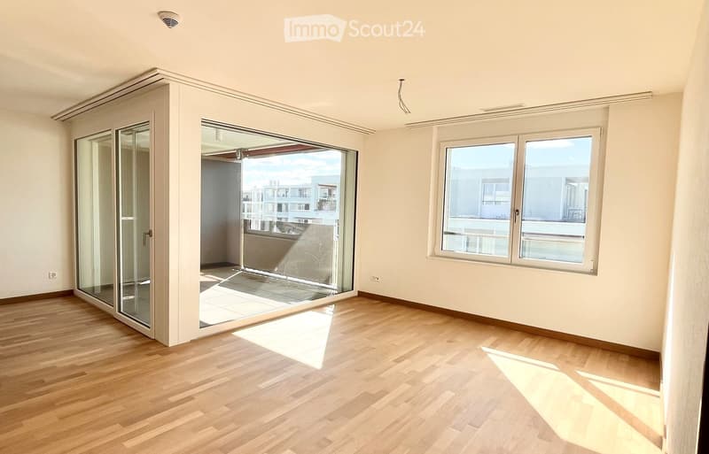 open room with balcony, glass door, hardwood floor, sliding glass door, window