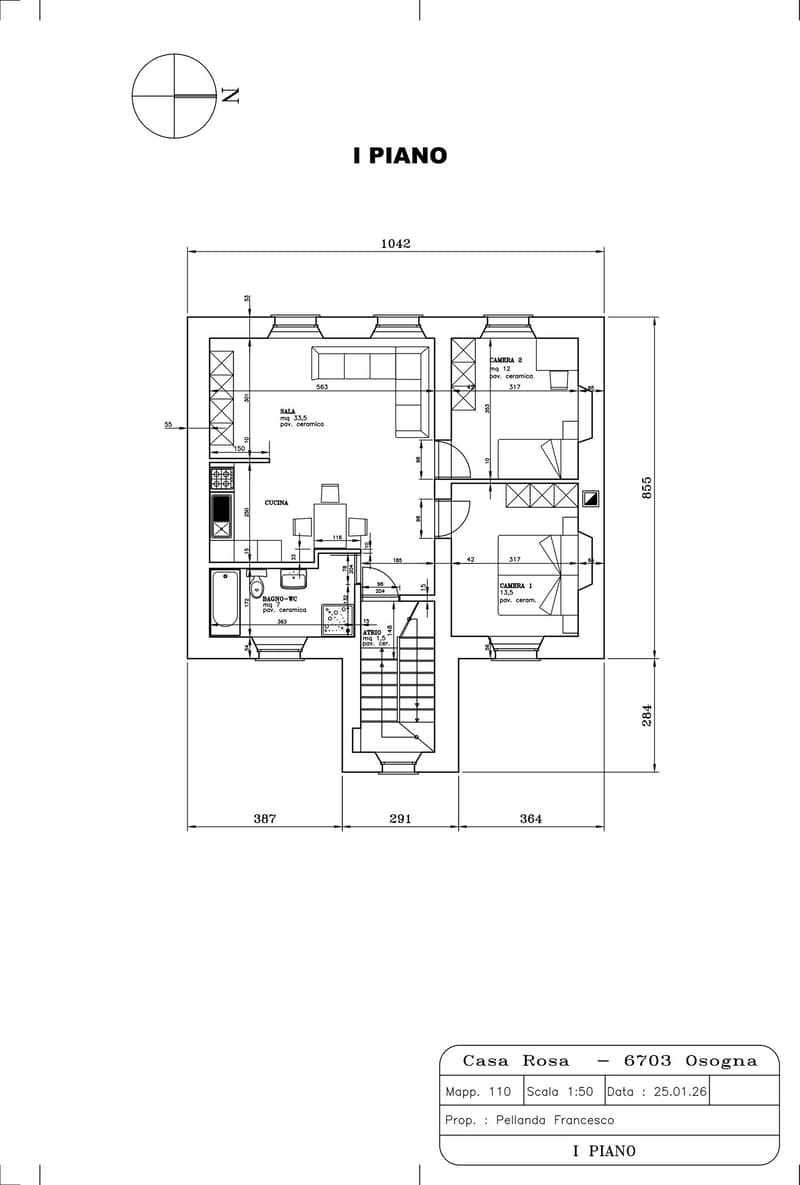 Floor plan of the first floor showing a living room, kitchen, two bedrooms, and a bathroom.