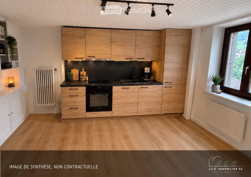Modern kitchen with light wooden cabinets, black countertops, stainless steel appliances, and a large window offering a view. Includes a sink, oven, coffee maker, and decorative plants.