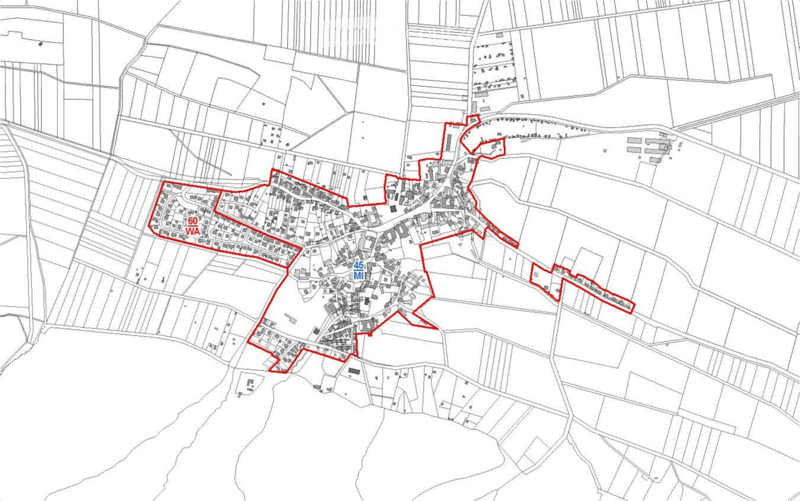 Floor plan of a residential area with multiple buildings and streets, highlighted in red outlines.